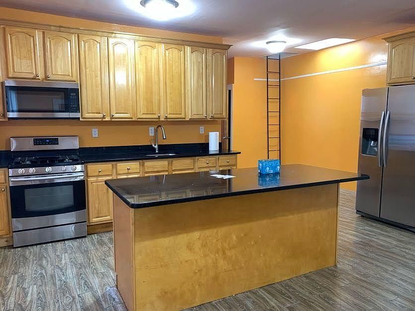 KITCHEN, NOTE SPACIOUS AREA NEXT TO FRIDGE