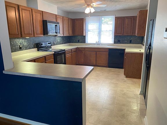 Huge Kitchen with tons of countertop space and cabinets.