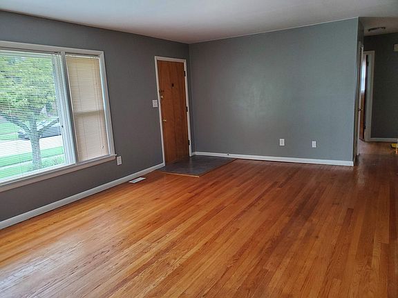 Living room is spacious with large picture window.