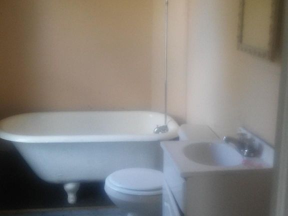 Shower curtain bar being installed