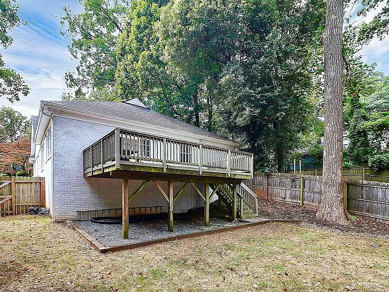 Fully fenced backyard and large deck