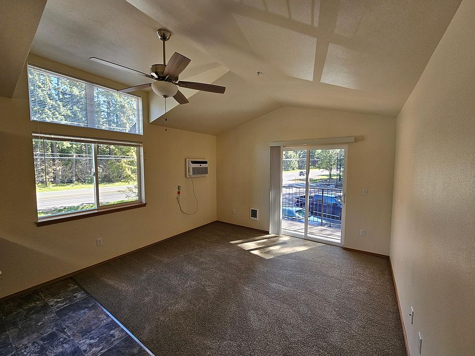 Living Room (upstairs street side units with vaulted ceiling and dormer)