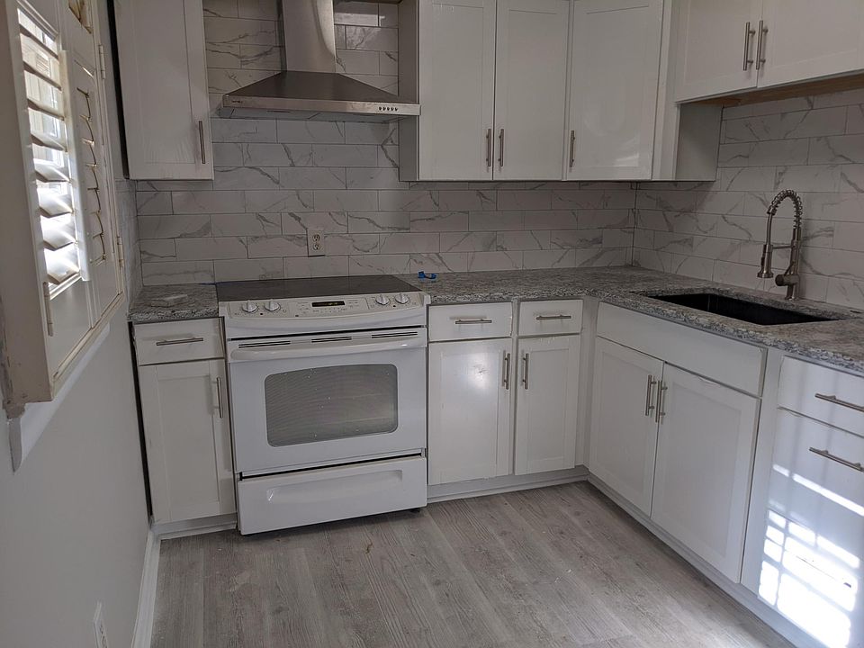 Brand new kitchen with granite countertops, SS range hood, beautiful backsplash, new flooring, stainless steel kitchen faucet. Ready for your to host your next gathering with an open dining room that flows right off the kitchen with beautiful refinished o