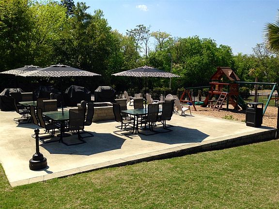 Community Patio with fenced in playground