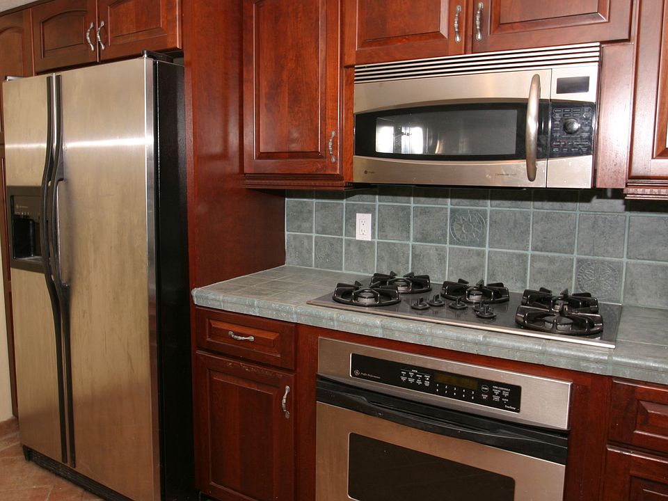 Cherrywood cabinetry and stainless appliances