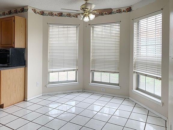Dining area with large windows.