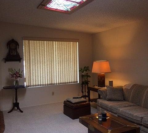 Living rm. w/stained glass @ skylight