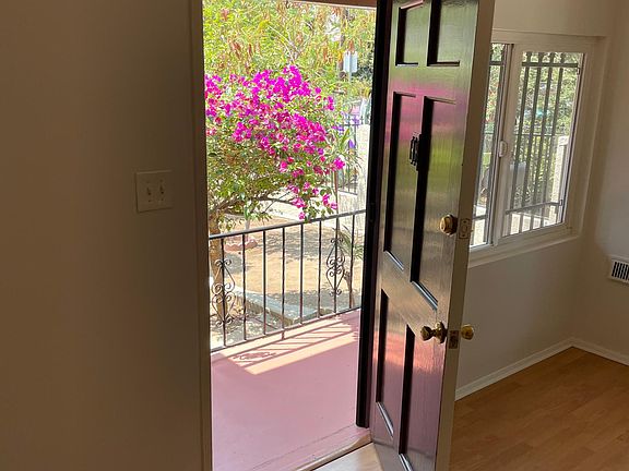 beautiful entry with plumeria and garden