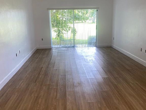 Great Living Dining room with great view to a large parking and water.