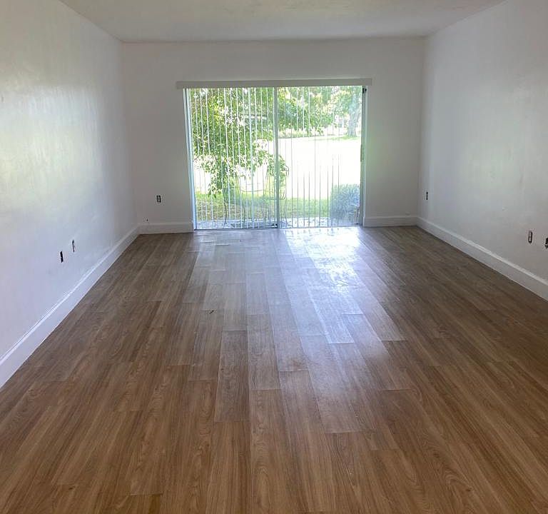 Great Living Dining room with great view to a large parking and water.
