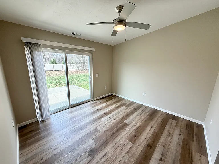 Den with view of the patio