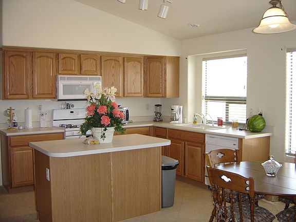 Kitchen has upgraded appliances, gas range, island, and tons of cabinets!