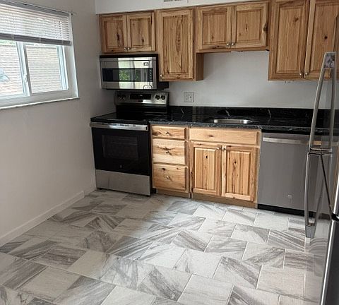 KITCHEN WITH ALL NEW STAINLESS STEEL APPLIANCES