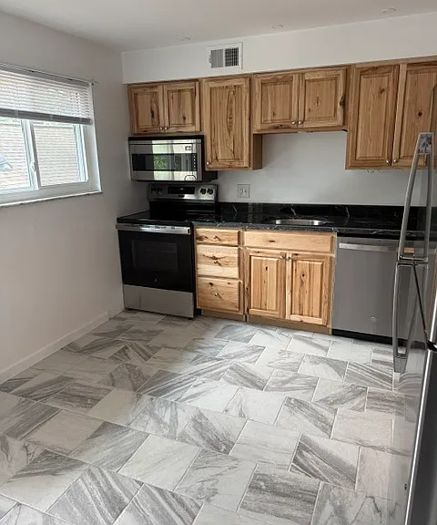 KITCHEN WITH ALL NEW STAINLESS STEEL APPLIANCES