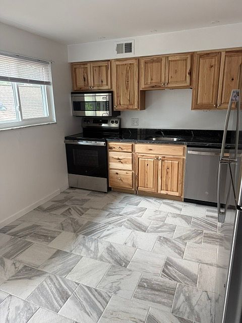 KITCHEN WITH ALL NEW STAINLESS STEEL APPLIANCES