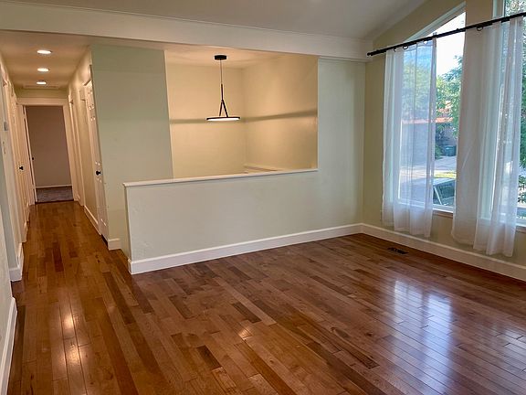 Solid newer hardwood floor. The real deal.