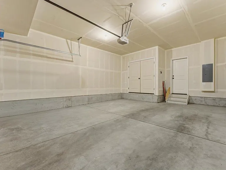 2 car garage that comes with 2 remotes and an exterior keypad