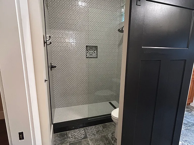 Custom oversized shower, with floor to ceiling tile is stunning,