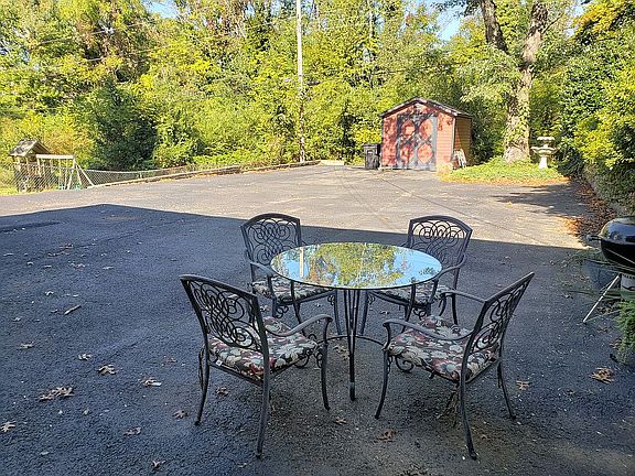patio space, driveway, &shed