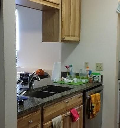 New kitchen, sink/eating bar view towards living area with l