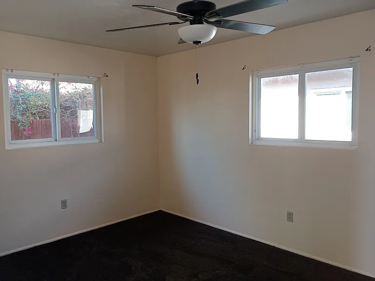 Bedroom #1 with ceiling fan.