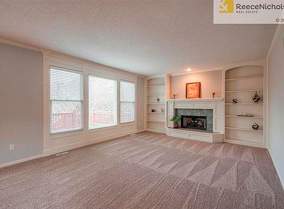 Nice size family room with gas insert log fireplace