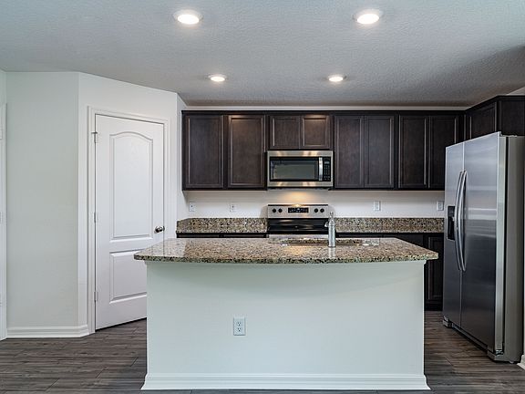 This move-in ready home features gorgeous granite countertops in the kitchen