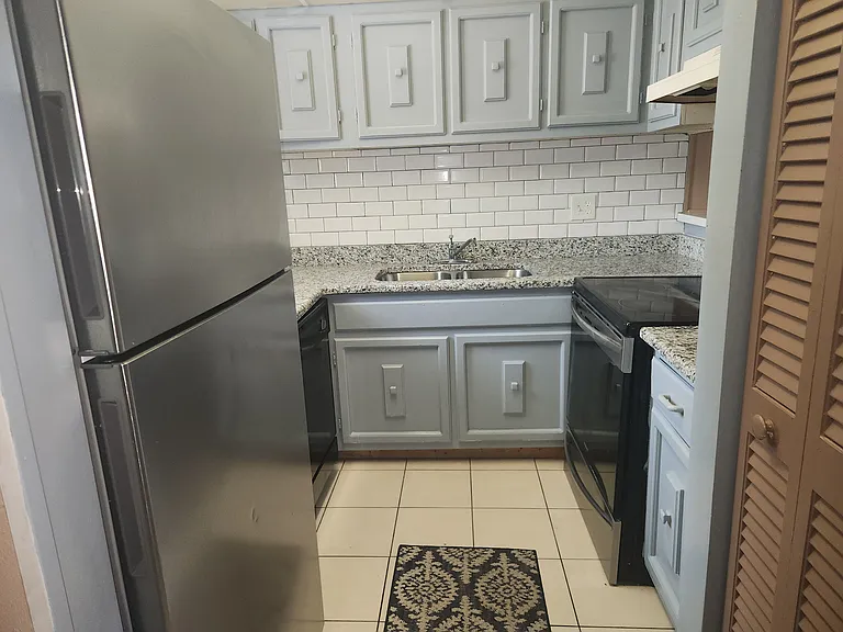 new granite counter tops and new subway tile in kitchen and bathroom