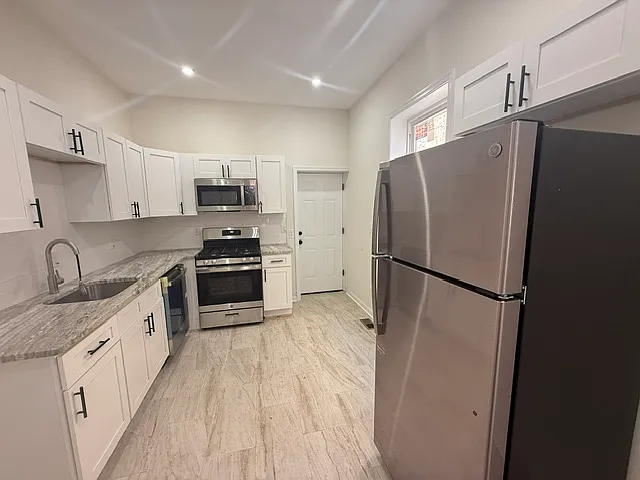 3-Bedroom Port Richmond Home with Central Air and Expansive Backyard — Photo 4