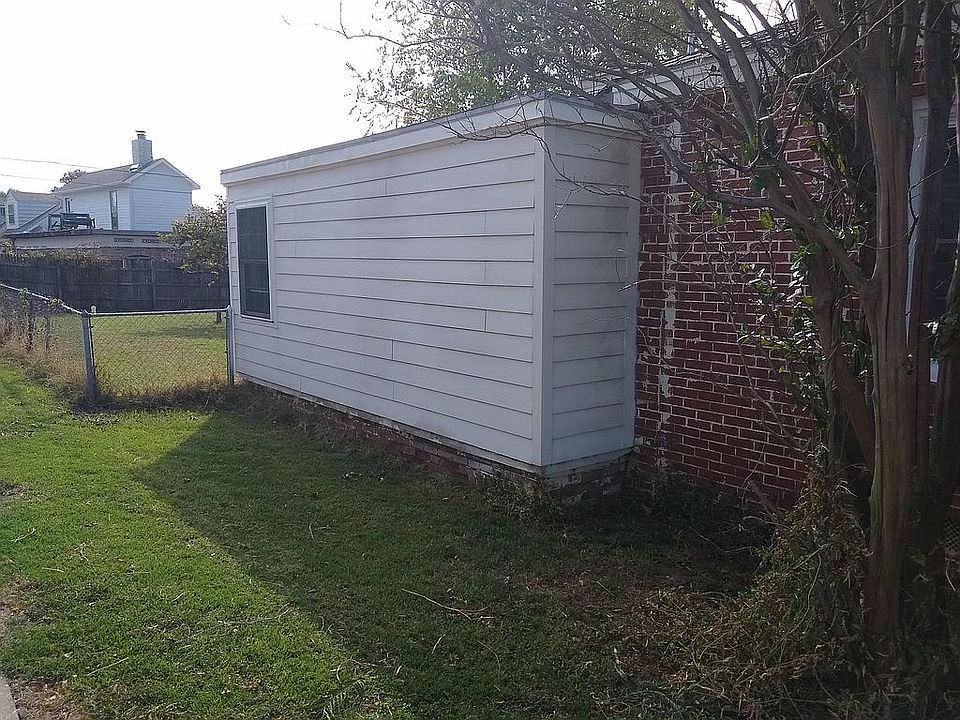 Left side of house.