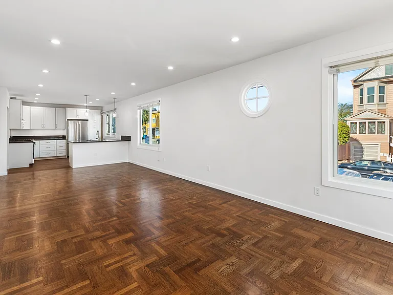 Open floor plan with kitchen, dining room, living room
