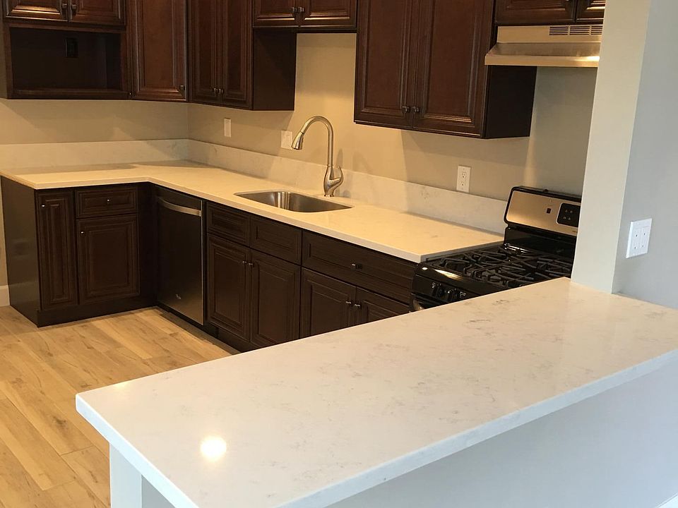 Kitchen with new SS appliances and plenty of quartz counter 