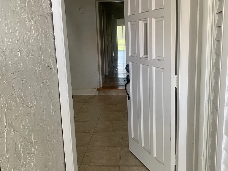 Gated entrance leads to front door