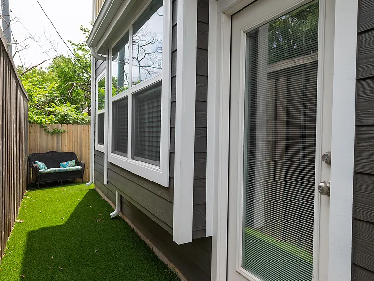 Cozy backyard with a comfortable outdoor couch_perfect for lounging or enjoying fresh air.