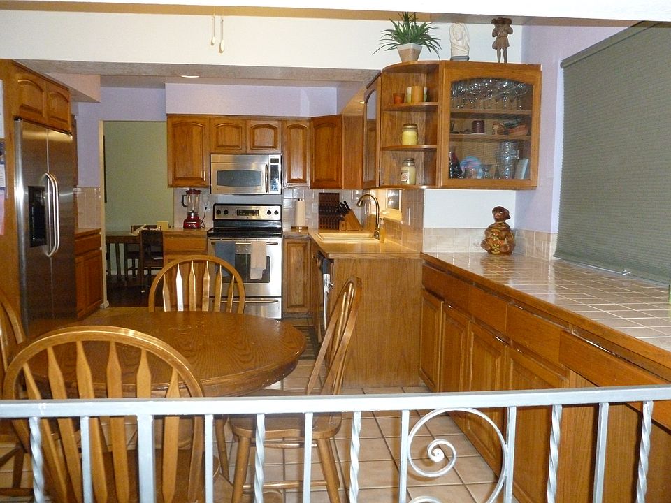 Large, open kitchen with stainless steel appliances included