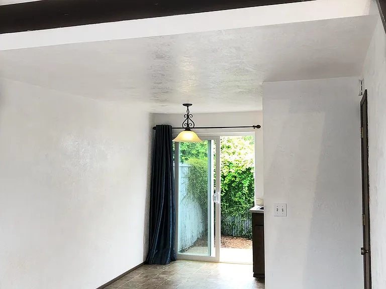 Living space with loft bedroom above