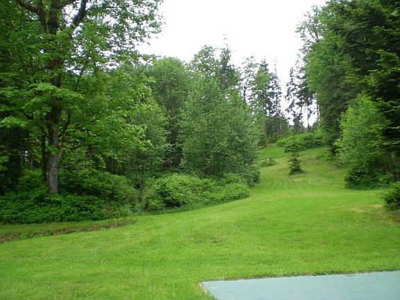 Looking up slope from manufactured home.