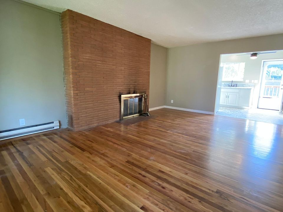 Living Room with Wood burning Fireplace