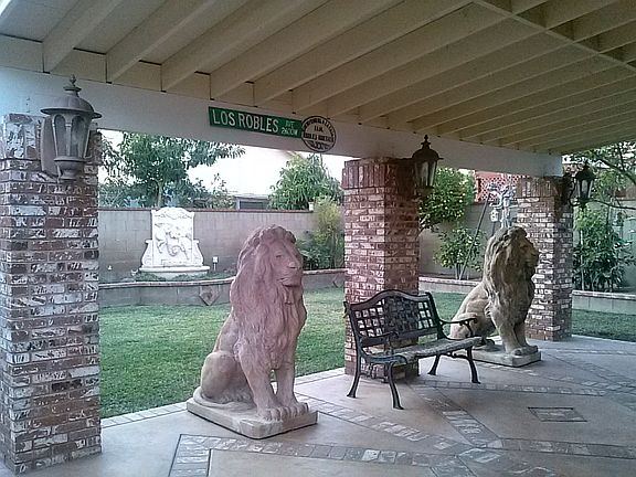 back yard patio with statues