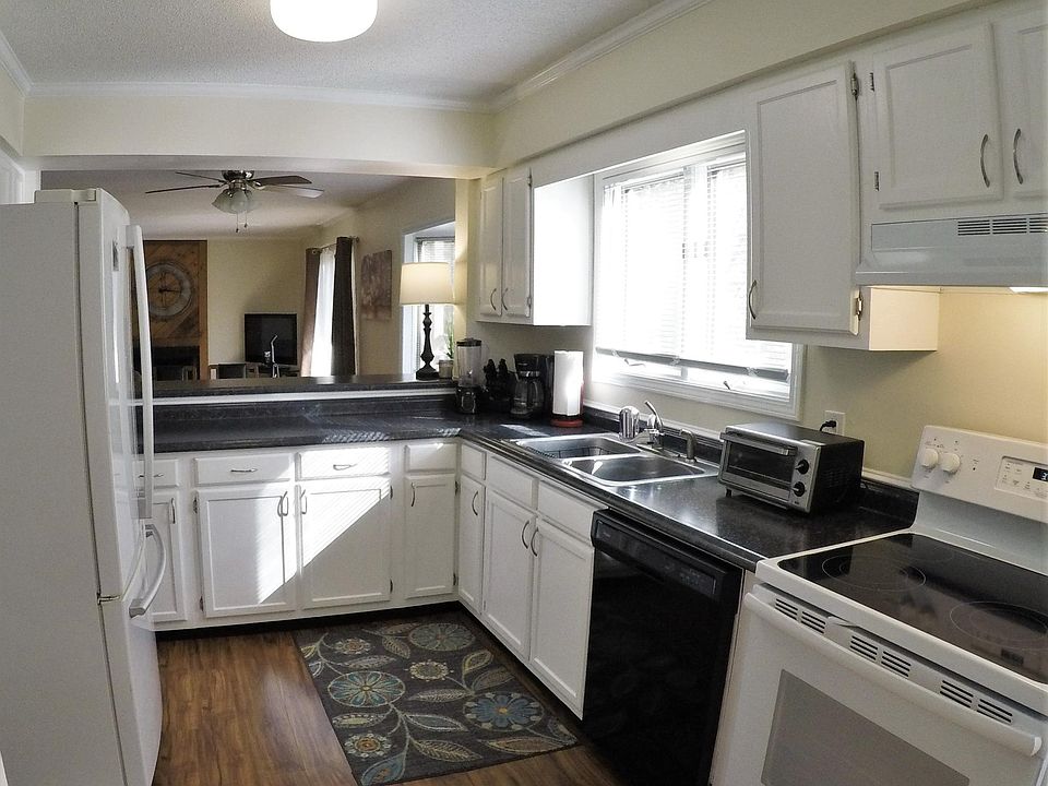 Kitchen well stocked with food preparation and cooking tools