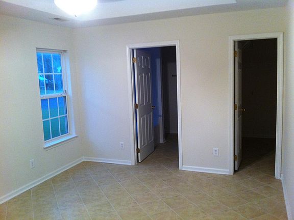 Master bedroom walking in closet and bathroom
