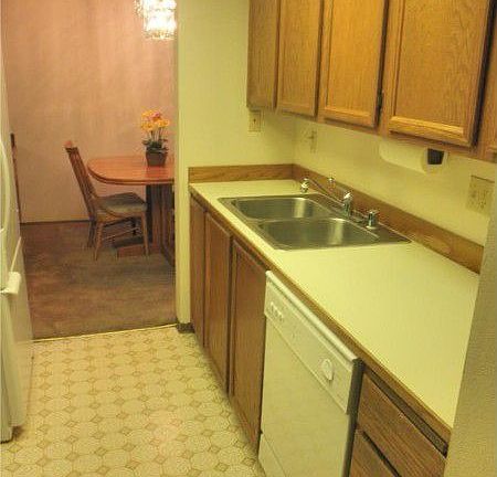 Kitchen has oak cabinents, newer white appliances. Handy to dining room.