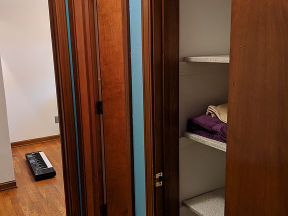(CCW from right) Pantry, bathroom, smaller bedroom