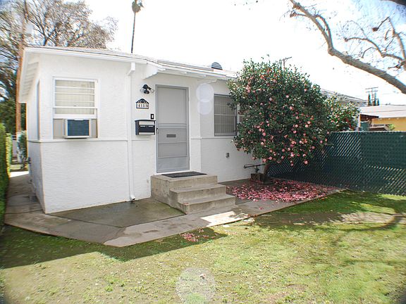 Front with Side Walkway leading to Back Yard and Parking Area