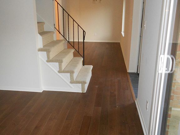 Entrance foyer is to the left in front of the stairs