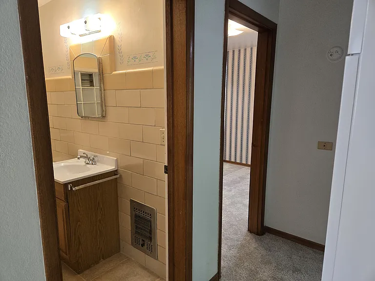 Hallway. Back Bedroom to the right and Bathroom to the left.