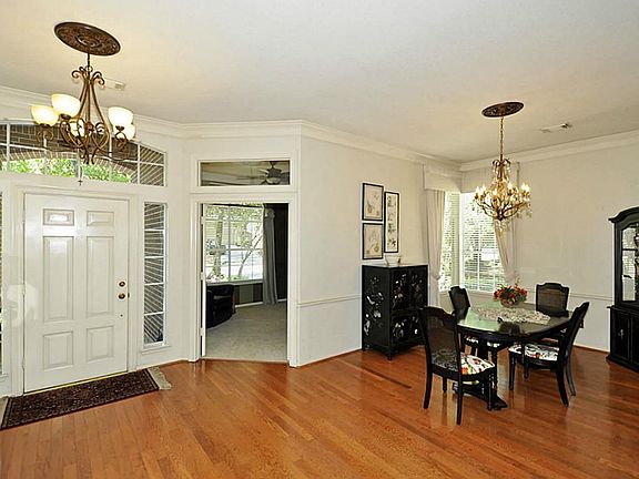 Open entryway with updated light fixtures.