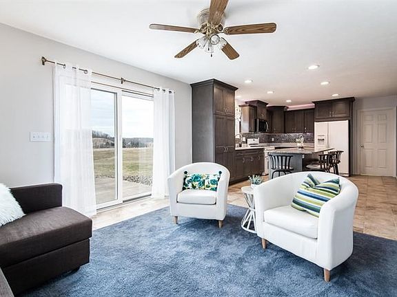 The kitchen, renovated in 2017, demands to be the entertainment stage, offering a family room / seating area for guests, with a 