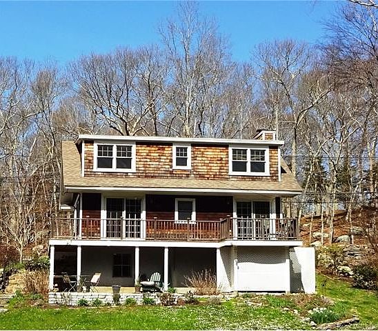Back of house faces pond