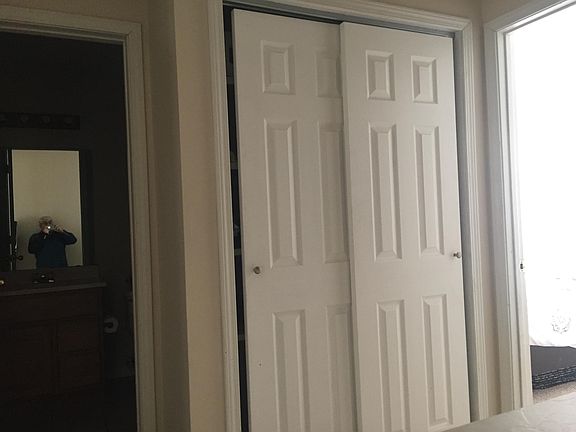 Upstairs hall closet between bath and front bedroom.